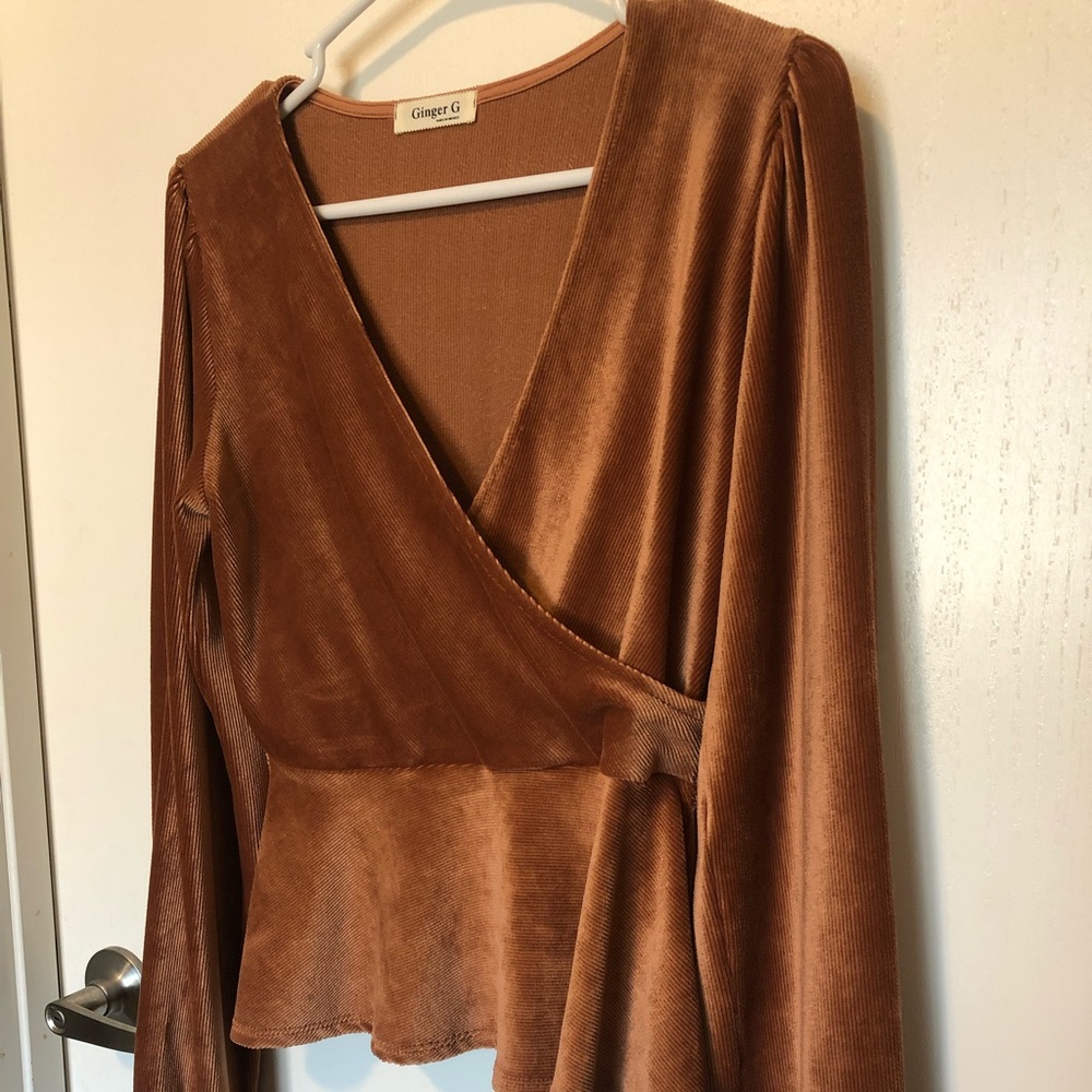 Burt orange top with a fun flare